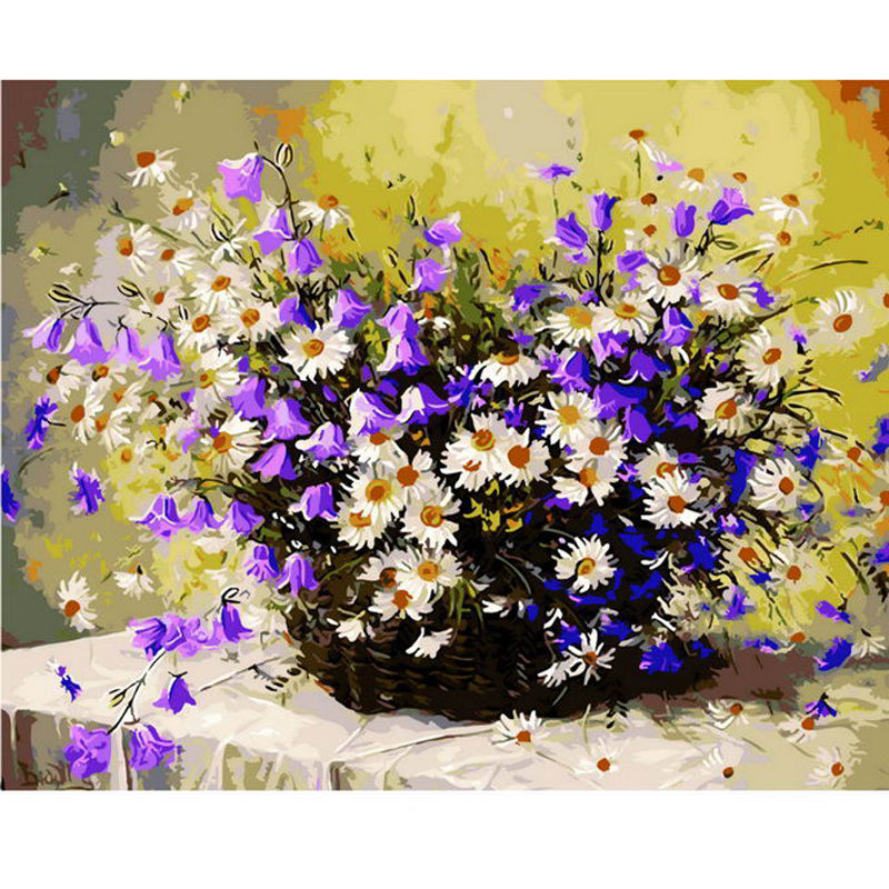 White daisies with purple flowers in vase