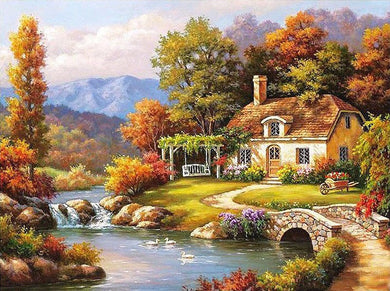 Cottage by the river at day